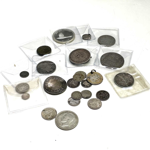 144 - Silver World Coinage - 19th and 20th Century. A bag containing approximately 25 coins in varying gra... 