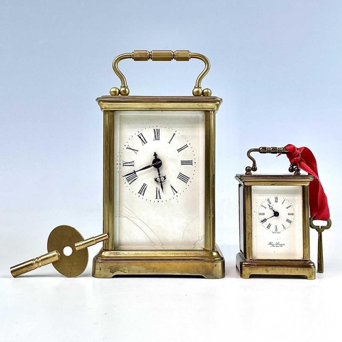 2901 - A miniature Swiss brass carriage timepiece, 20th century, by M Norman, height 6.5cm, together with a... 