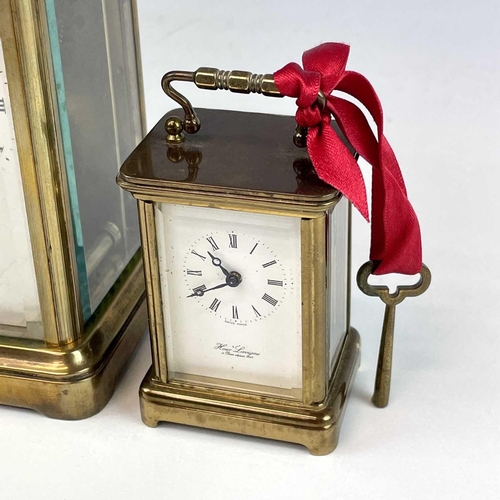 2901 - A miniature Swiss brass carriage timepiece, 20th century, by M Norman, height 6.5cm, together with a... 