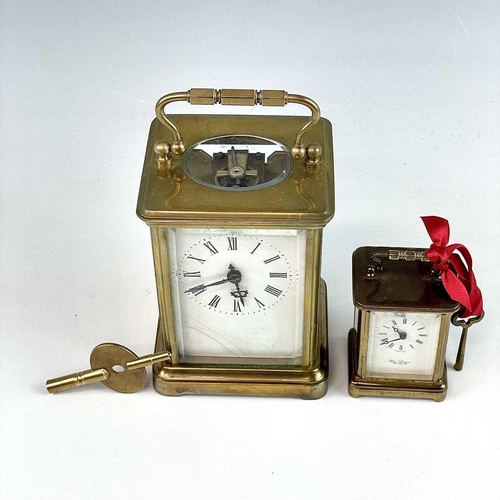 2901 - A miniature Swiss brass carriage timepiece, 20th century, by M Norman, height 6.5cm, together with a... 