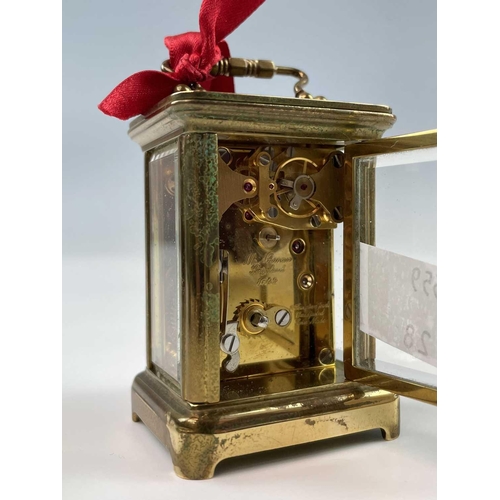 2901 - A miniature Swiss brass carriage timepiece, 20th century, by M Norman, height 6.5cm, together with a... 