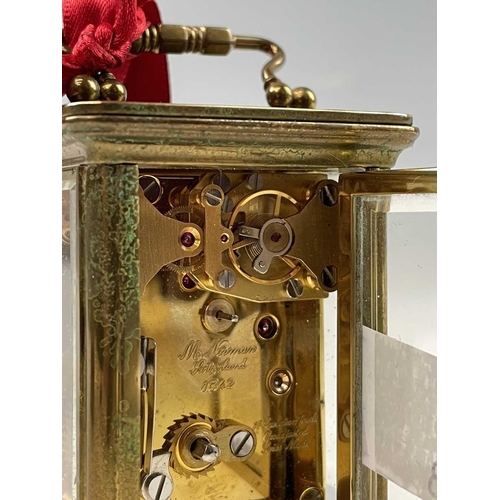 2901 - A miniature Swiss brass carriage timepiece, 20th century, by M Norman, height 6.5cm, together with a... 