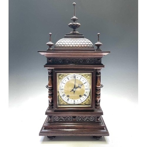 2903 - A German Winterhalder and Hofmeier oak architectural bracket clock, with turned finials and matt bra... 