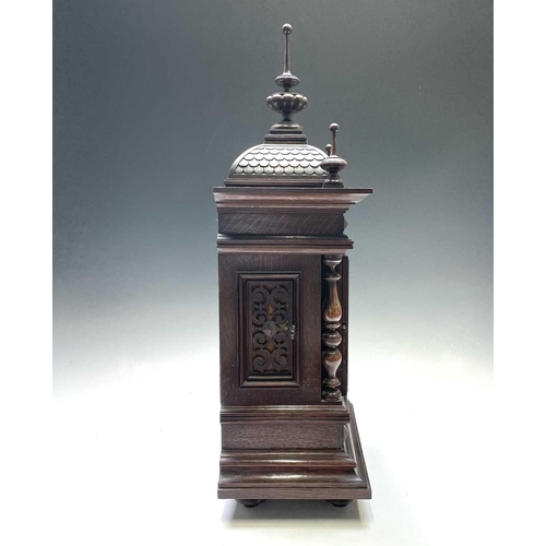 2903 - A German Winterhalder and Hofmeier oak architectural bracket clock, with turned finials and matt bra... 