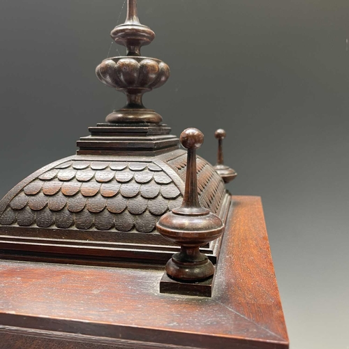 2903 - A German Winterhalder and Hofmeier oak architectural bracket clock, with turned finials and matt bra... 