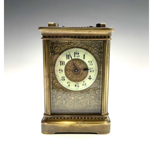 2909 - A late 19th century French brass carriage timepiece with Arabic numerals on an enamel ring face with... 
