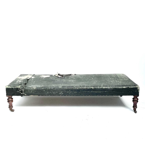 3003 - A Victorian mahogany framed day bed couch or Ottoman, with later rexine upholstery and raised on tur... 