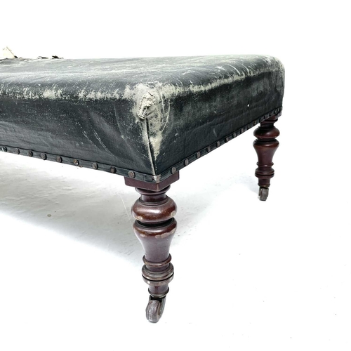 3003 - A Victorian mahogany framed day bed couch or Ottoman, with later rexine upholstery and raised on tur... 