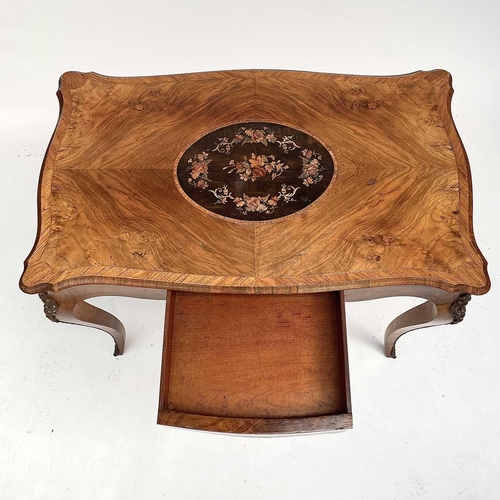 3004 - A Late Victorian walnut marquetry and brass mounted shaped table, the inlaid central decoration of s... 