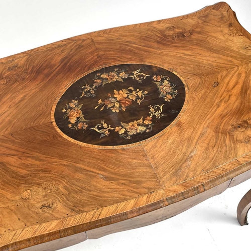 3004 - A Late Victorian walnut marquetry and brass mounted shaped table, the inlaid central decoration of s... 