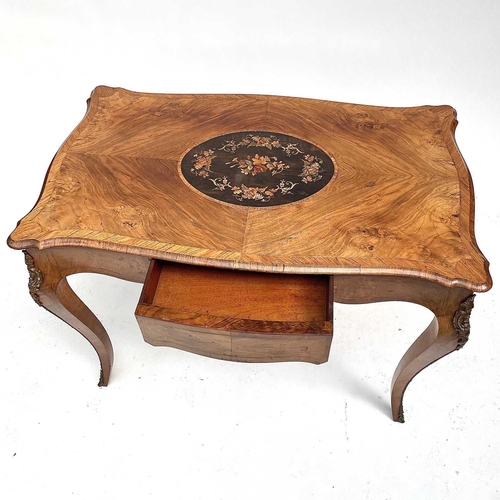 3004 - A Late Victorian walnut marquetry and brass mounted shaped table, the inlaid central decoration of s... 
