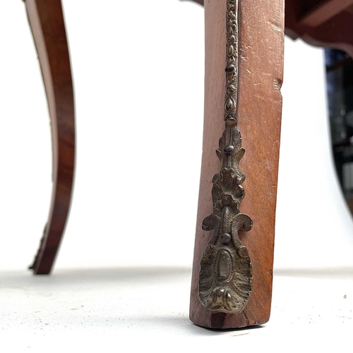 3004 - A Late Victorian walnut marquetry and brass mounted shaped table, the inlaid central decoration of s... 