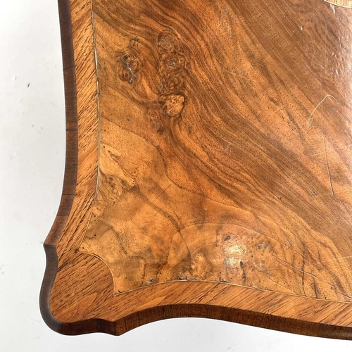 3004 - A Late Victorian walnut marquetry and brass mounted shaped table, the inlaid central decoration of s... 