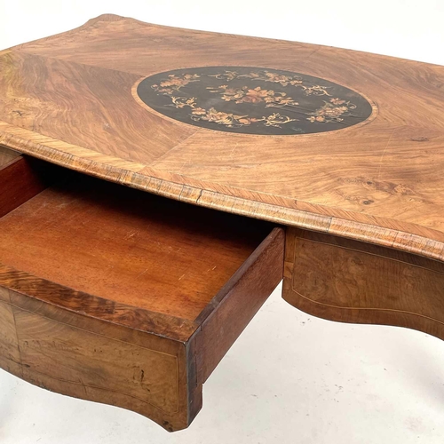 3004 - A Late Victorian walnut marquetry and brass mounted shaped table, the inlaid central decoration of s... 