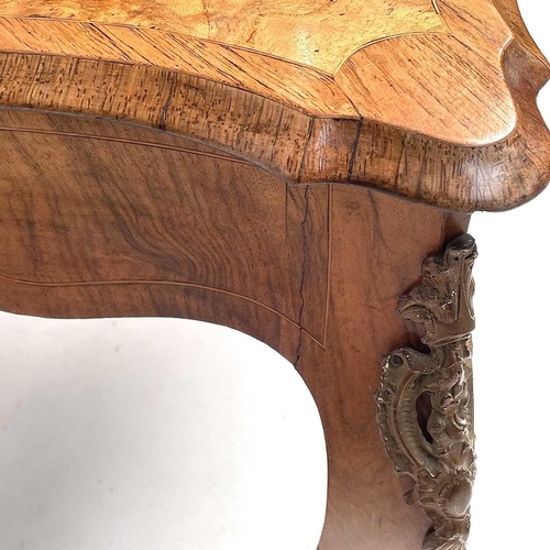 3004 - A Late Victorian walnut marquetry and brass mounted shaped table, the inlaid central decoration of s... 