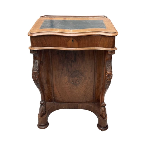 3011 - A Victorian walnut Davenport, with slope top and fitted interior with four real and four dummy drawe... 