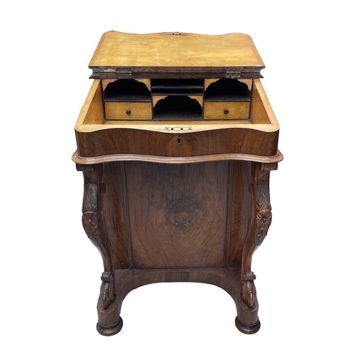 3011 - A Victorian walnut Davenport, with slope top and fitted interior with four real and four dummy drawe... 