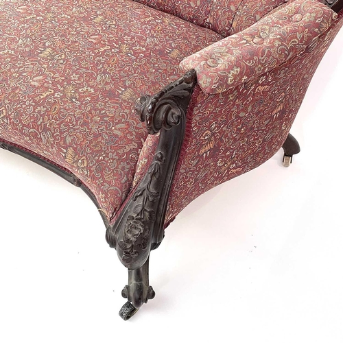 3014 - A Victorian mahogany chaise longue, the moulded and shaped back with floral and foliate carved decor... 