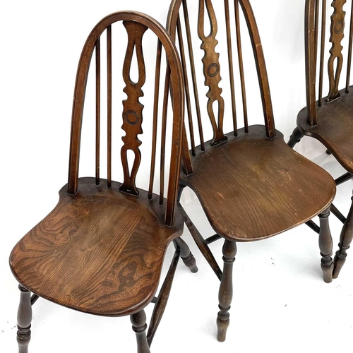 3015 - Set four beech and elm dining chairs, the spindle backs with central splats with carved roundels, so... 