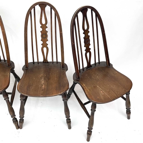 3015 - Set four beech and elm dining chairs, the spindle backs with central splats with carved roundels, so... 