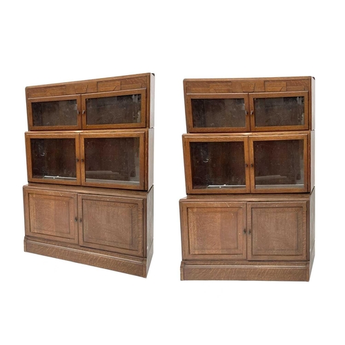 3019 - A pair of oak sectional bookcases, the 1930s, each with Odeonesque moulded frieze above two pairs of... 