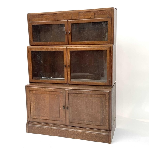 3019 - A pair of oak sectional bookcases, the 1930s, each with Odeonesque moulded frieze above two pairs of... 