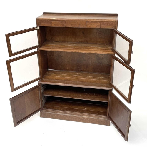 3019 - A pair of oak sectional bookcases, the 1930s, each with Odeonesque moulded frieze above two pairs of... 