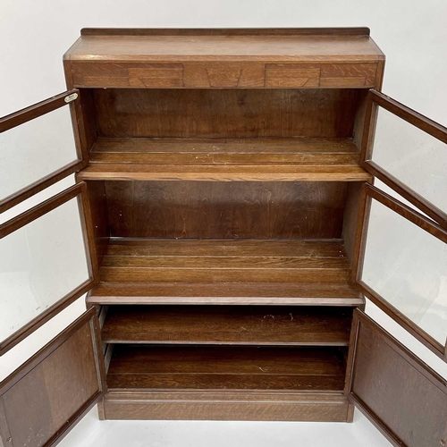 3019 - A pair of oak sectional bookcases, the 1930s, each with Odeonesque moulded frieze above two pairs of... 