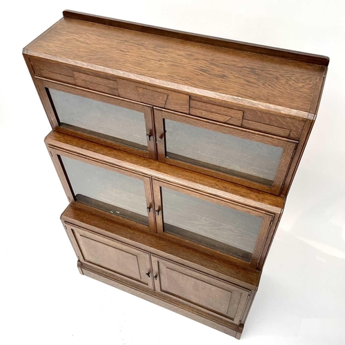 3019 - A pair of oak sectional bookcases, the 1930s, each with Odeonesque moulded frieze above two pairs of... 