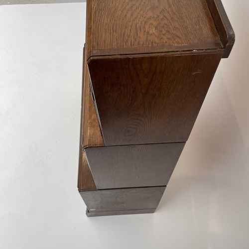 3019 - A pair of oak sectional bookcases, the 1930s, each with Odeonesque moulded frieze above two pairs of... 