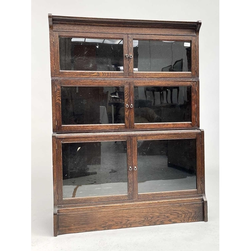 3020 - An oak sectional bookcase, 1930s, the three parts each with twin glazed hinged doors, height 119cm, ... 