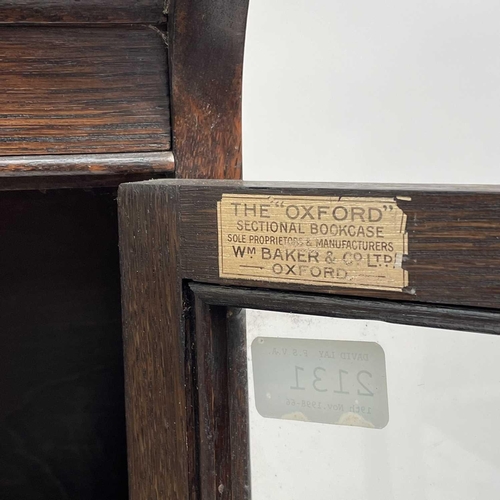 3020 - An oak sectional bookcase, 1930s, the three parts each with twin glazed hinged doors, height 119cm, ... 