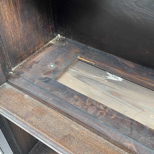 3020 - An oak sectional bookcase, 1930s, the three parts each with twin glazed hinged doors, height 119cm, ... 