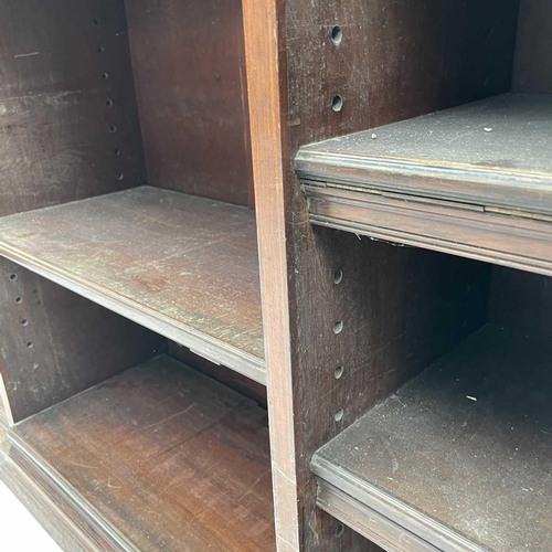 3084 - A 19th century rosewood open bookcase, possibly Colonial, with a slight breakfront and fitted adjust... 