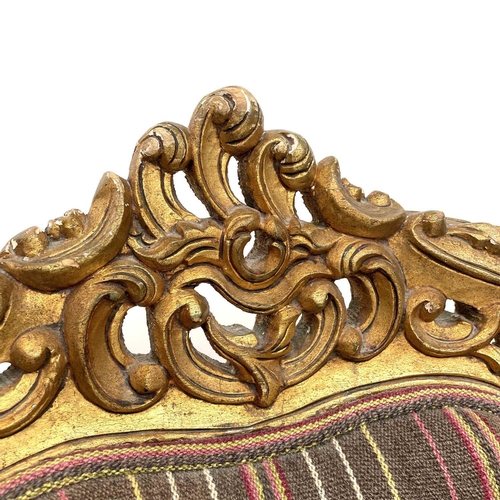 3133 - A pair of early 20th century French giltwood armchairs carved with scrolls and flowers, height 118cm... 