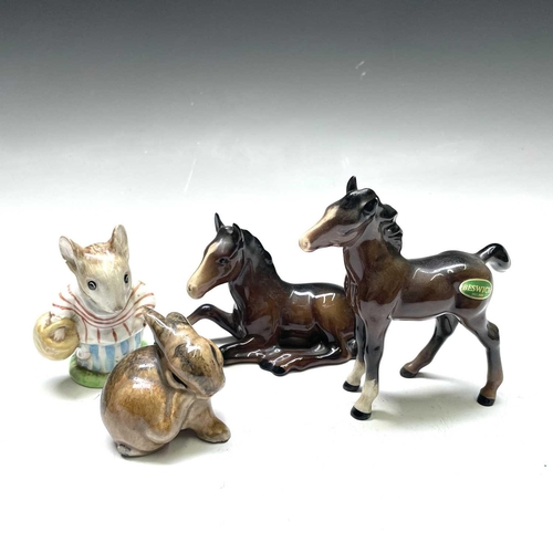828 - A Beswick figure of a recumbent fowl, length 13cm, another standing, and two other figures (4).