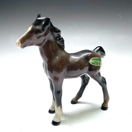 828 - A Beswick figure of a recumbent fowl, length 13cm, another standing, and two other figures (4).