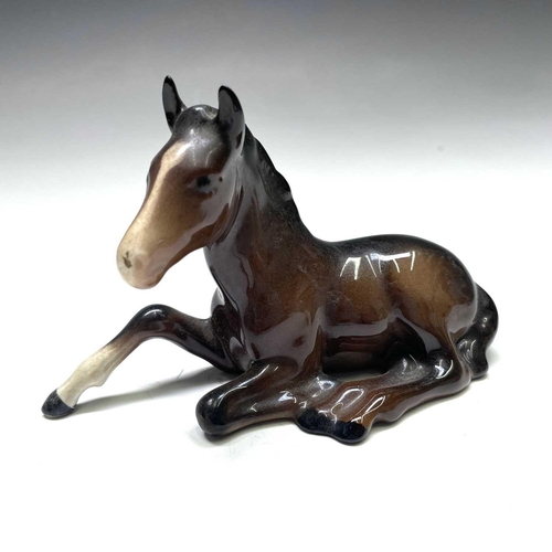828 - A Beswick figure of a recumbent fowl, length 13cm, another standing, and two other figures (4).