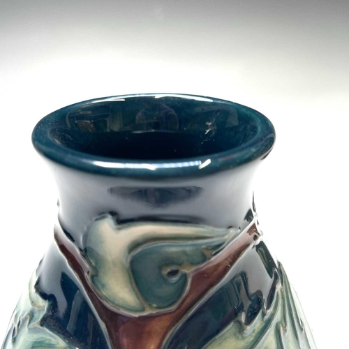 830 - A Moorcroft pottery vase Apples signed to base, height 14cm together with a Moorcroft pottery Clemat... 