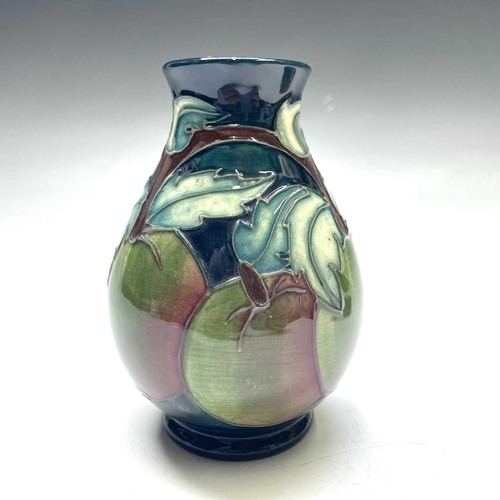 830 - A Moorcroft pottery vase Apples signed to base, height 14cm together with a Moorcroft pottery Clemat... 