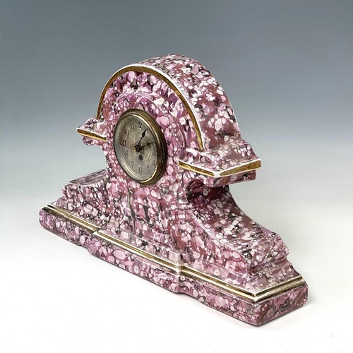 845 - A French pink lustre three-piece clock set, circa 1920, with mottled splash decoration, with two cla... 