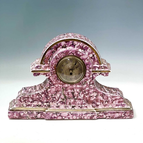 845 - A French pink lustre three-piece clock set, circa 1920, with mottled splash decoration, with two cla... 