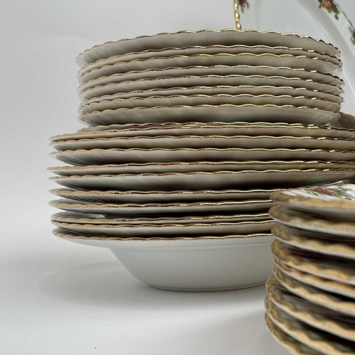 879 - A Royal Albert Old Country Roses part service comprising two large oval platters, smaller oval platt... 