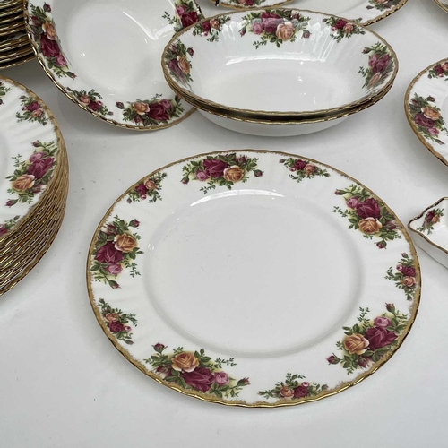 879 - A Royal Albert Old Country Roses part service comprising two large oval platters, smaller oval platt... 