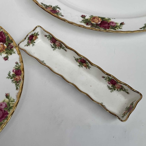 879 - A Royal Albert Old Country Roses part service comprising two large oval platters, smaller oval platt... 