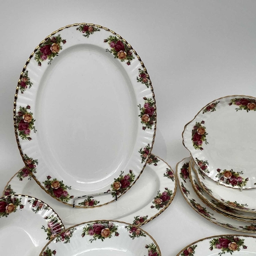 879 - A Royal Albert Old Country Roses part service comprising two large oval platters, smaller oval platt... 