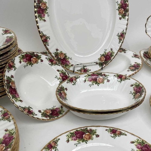 879 - A Royal Albert Old Country Roses part service comprising two large oval platters, smaller oval platt... 