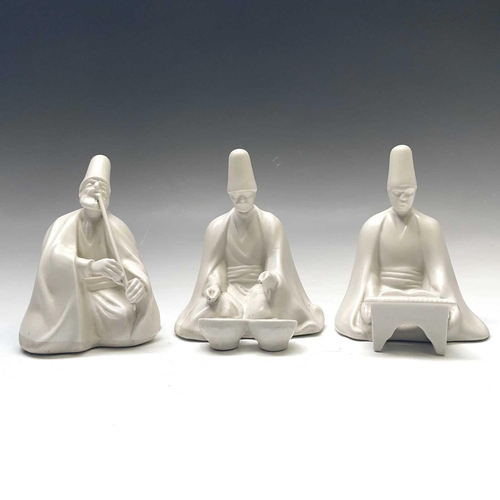 882 - Three Yildiz Imperial porcelain figures of Sufi Muslim musicians, height 13cm.