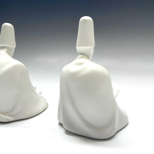 882 - Three Yildiz Imperial porcelain figures of Sufi Muslim musicians, height 13cm.