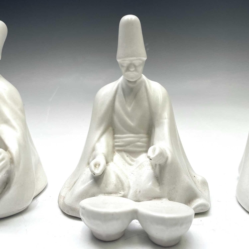 882 - Three Yildiz Imperial porcelain figures of Sufi Muslim musicians, height 13cm.